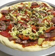Pizza uncooked on tray